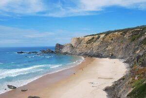 Praia da Amália beach surrounded by cliffs near Zambujeira do Mar, Alentejo coast, Portugal