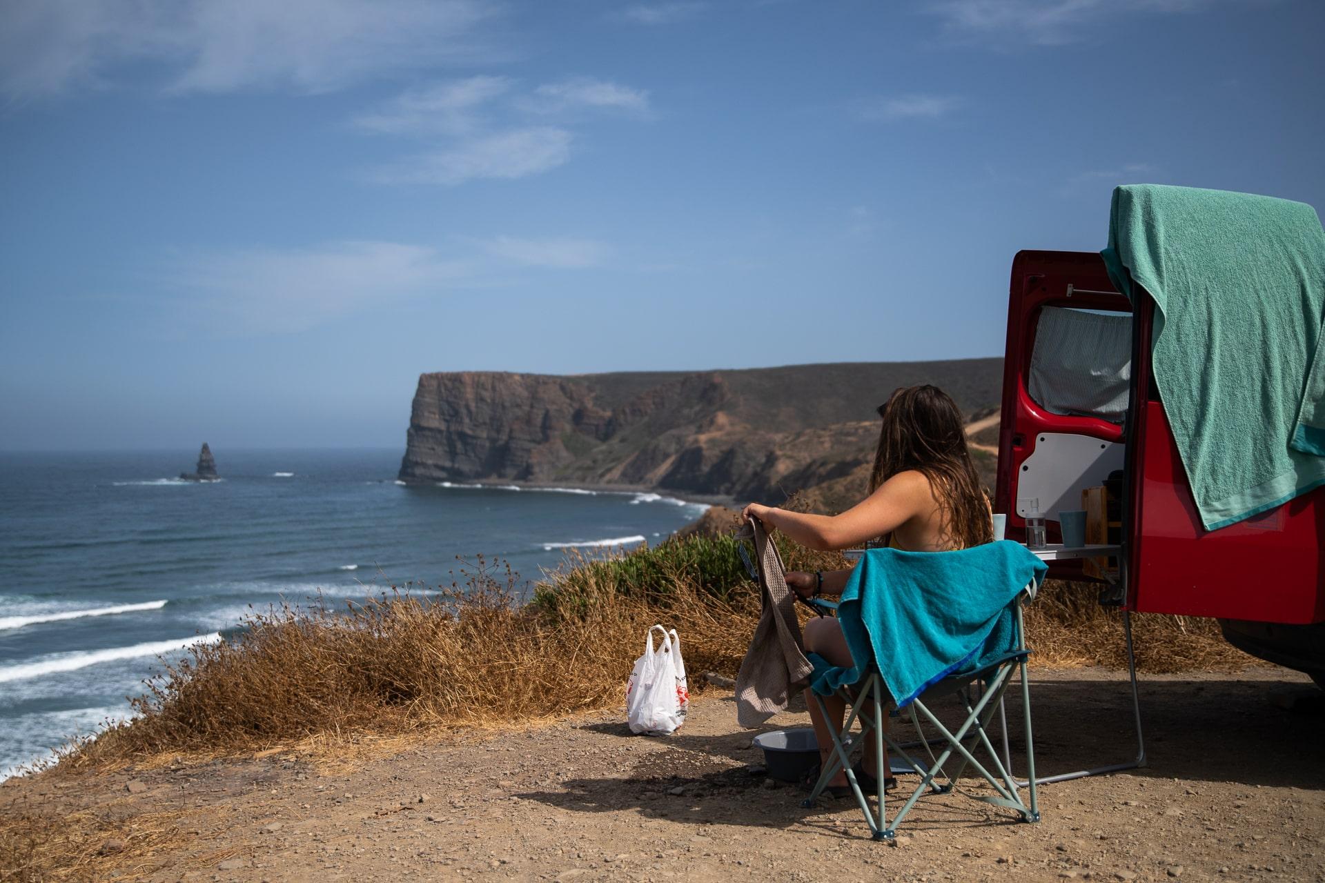 Things to do In Faro: Couple enjoying breakfast at a campervan campsite near Faro