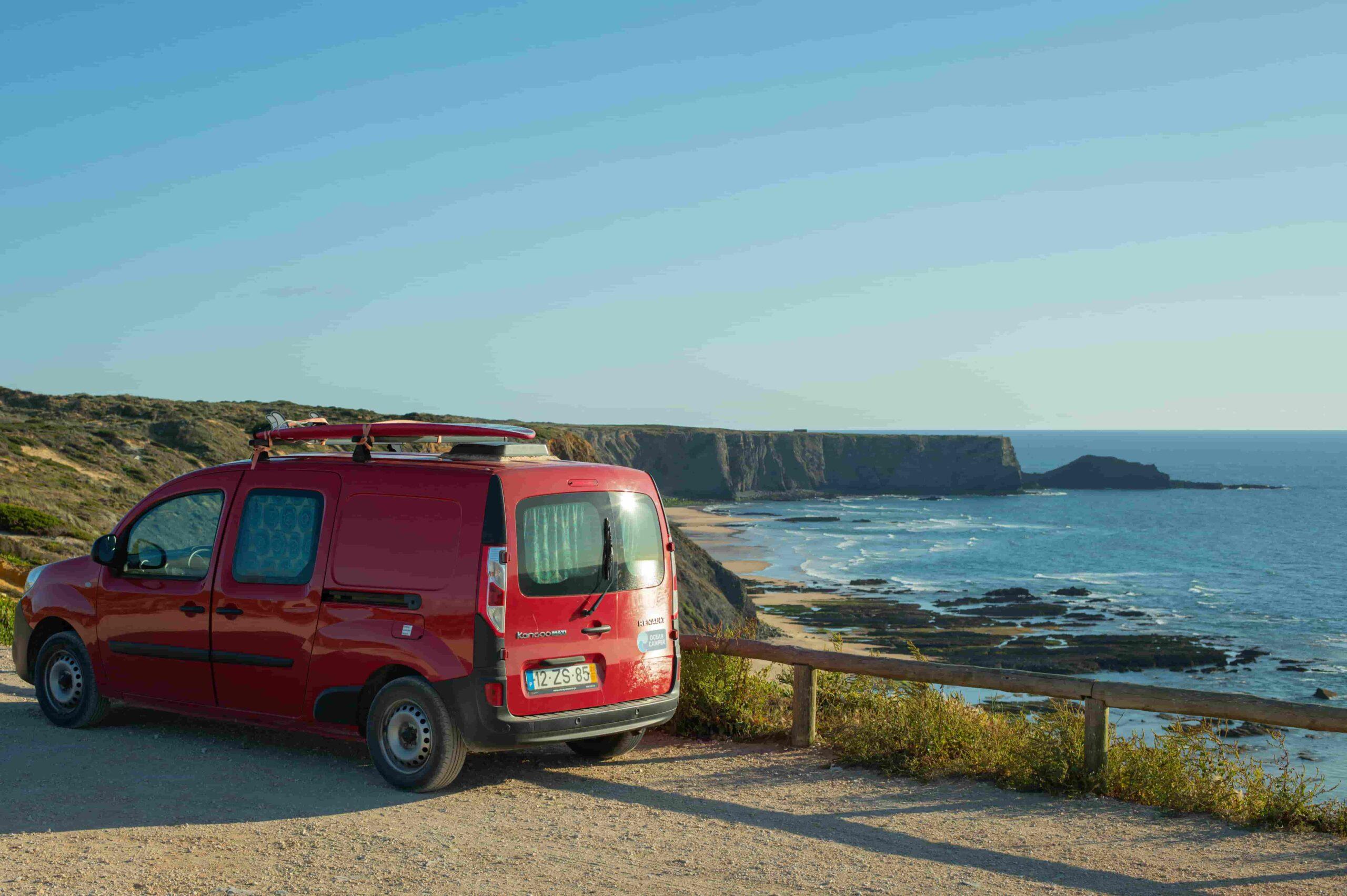 Mini campervan in Portugal parked by the coast with ocean view