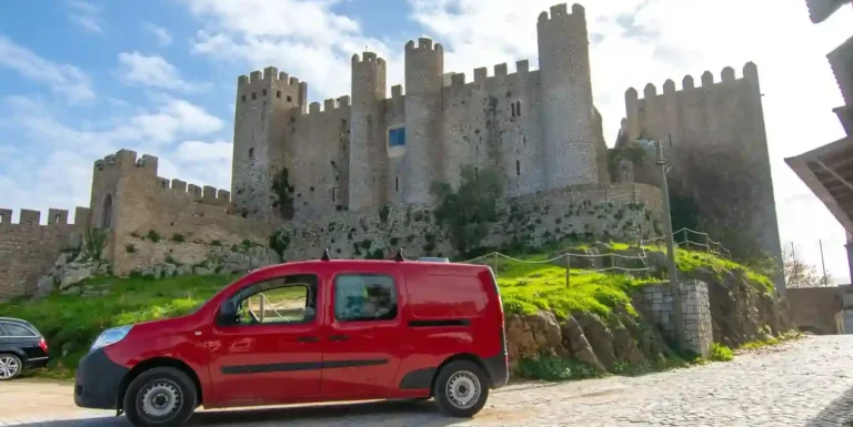 Mini campervan rental in Lisbon near historic castle landmark