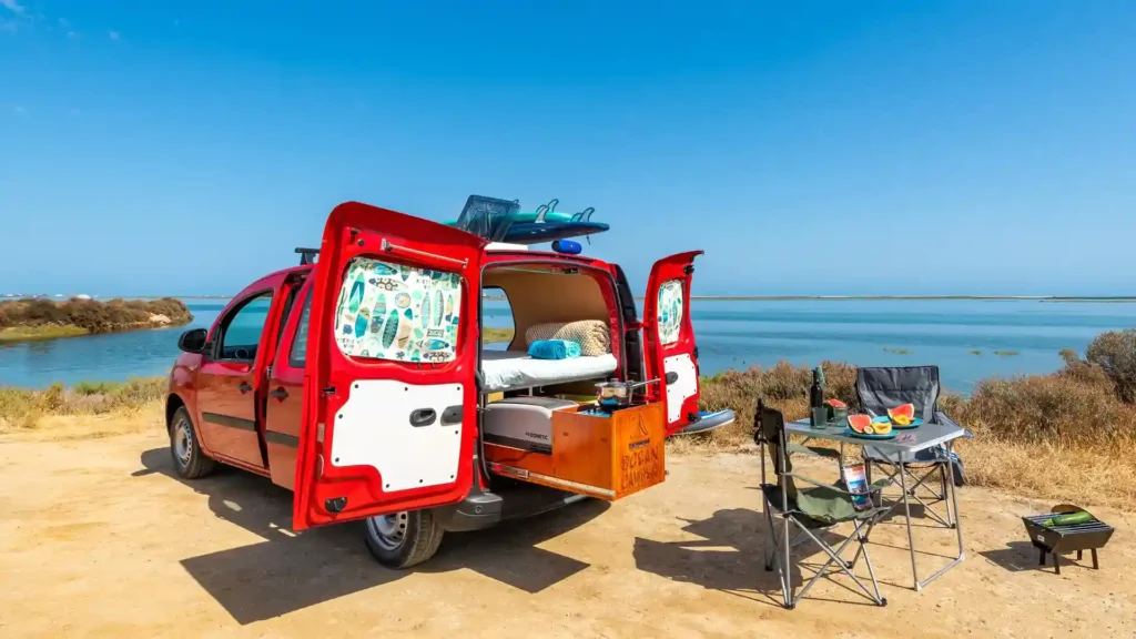 Fully equipped mini campervan rental in Portugal with outdoor kitchen and camping setup